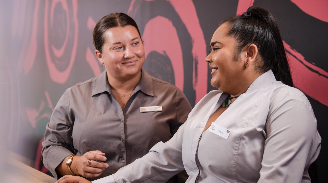 Two women smiling